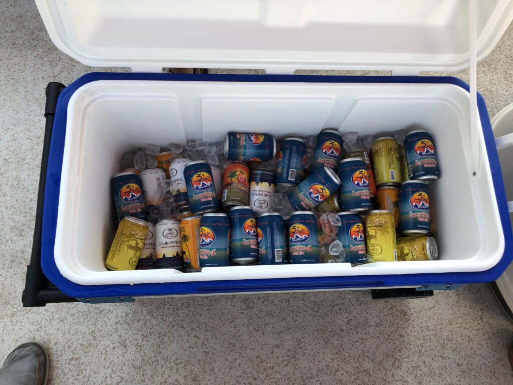 looking overhead of an open cooler full of drinks