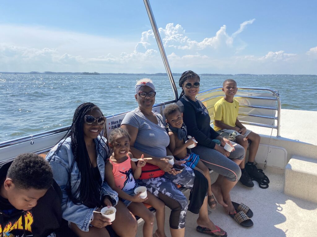 Family of 6 on a boat and enjoying ice cream