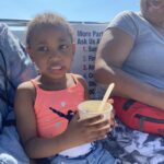 Young girl enjoying ice cream on a boat in Ocean City MD